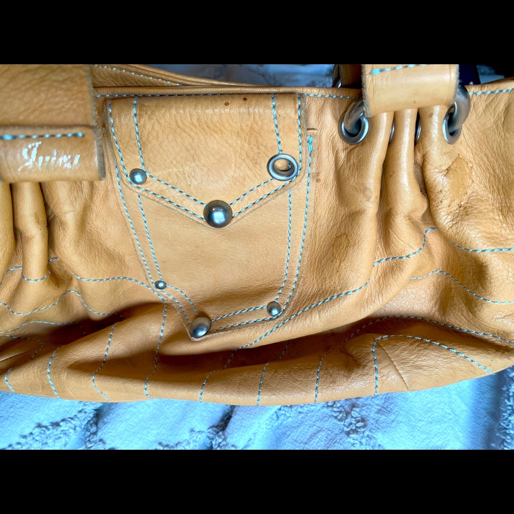 A cute Juicy beige leather small bag